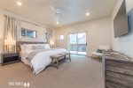 Master Bedroom with King bed, en suite, TV and private balcony
